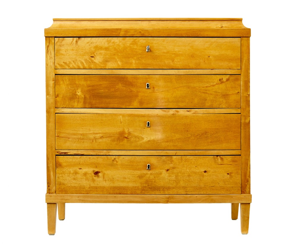 A 19th-century Swedish birch chest featuring four drawers with brass escutcheons, a stepped caddy top moulding, and tapered square legs. View II