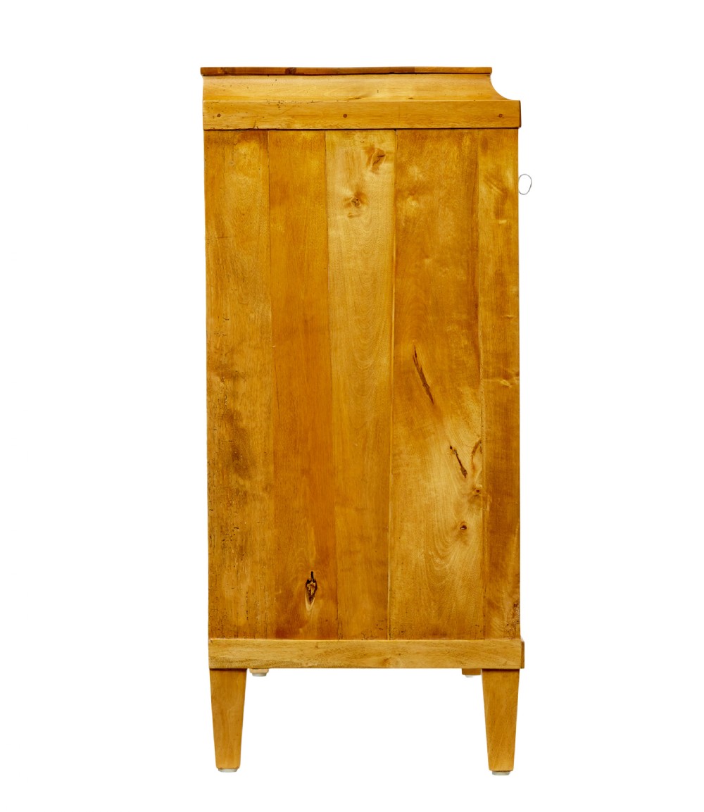 A 19th-century Swedish birch chest featuring four drawers with brass escutcheons, a stepped caddy top moulding, and tapered square legs. View VI
