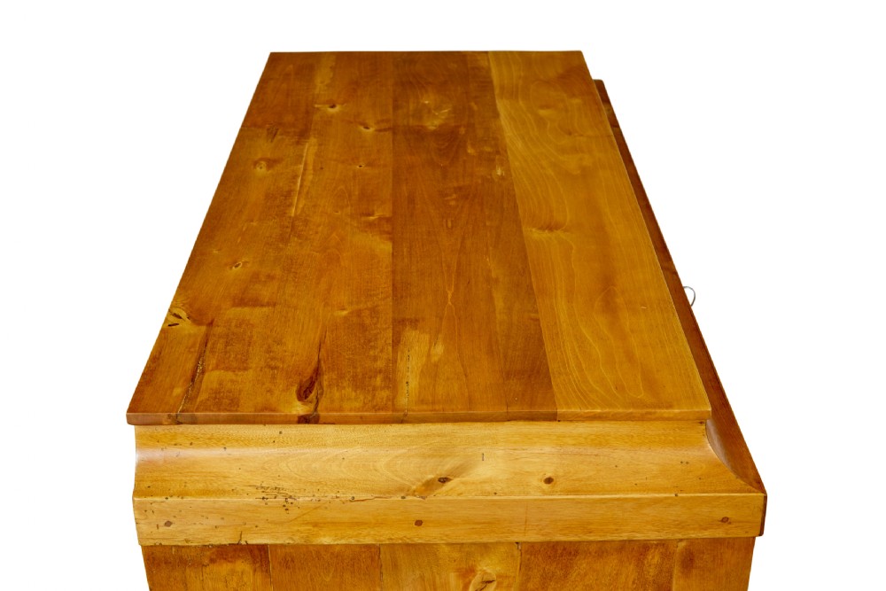 A 19th-century Swedish birch chest featuring four drawers with brass escutcheons, a stepped caddy top moulding, and tapered square legs. View VII