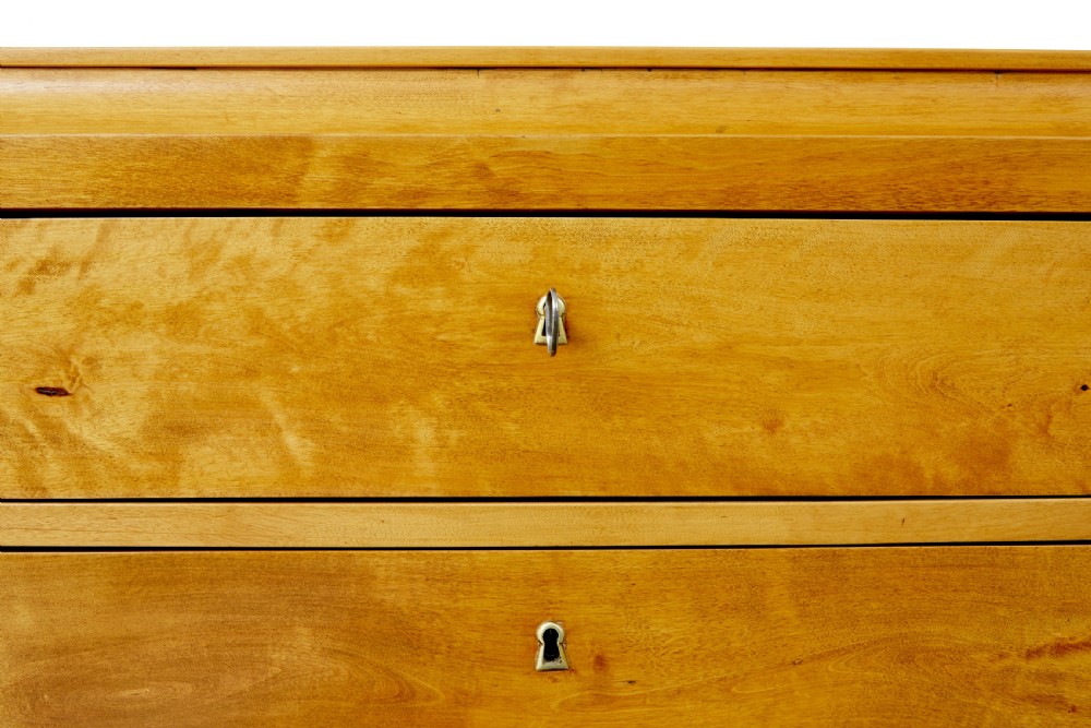 A 19th-century Swedish birch chest featuring four drawers with brass escutcheons, a stepped caddy top moulding, and tapered square legs. View VIII
