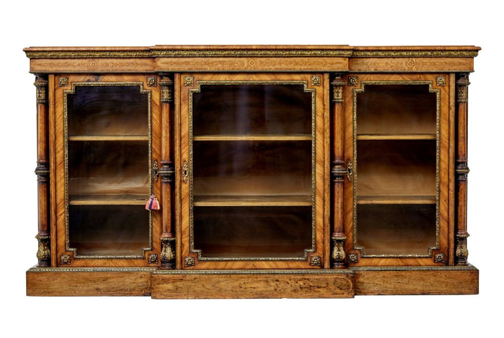A mid-19th century Victorian walnut credenza featuring three glass-fronted doors, intricate marquetry inlay, and ornate gilt-bronze mounts. View II