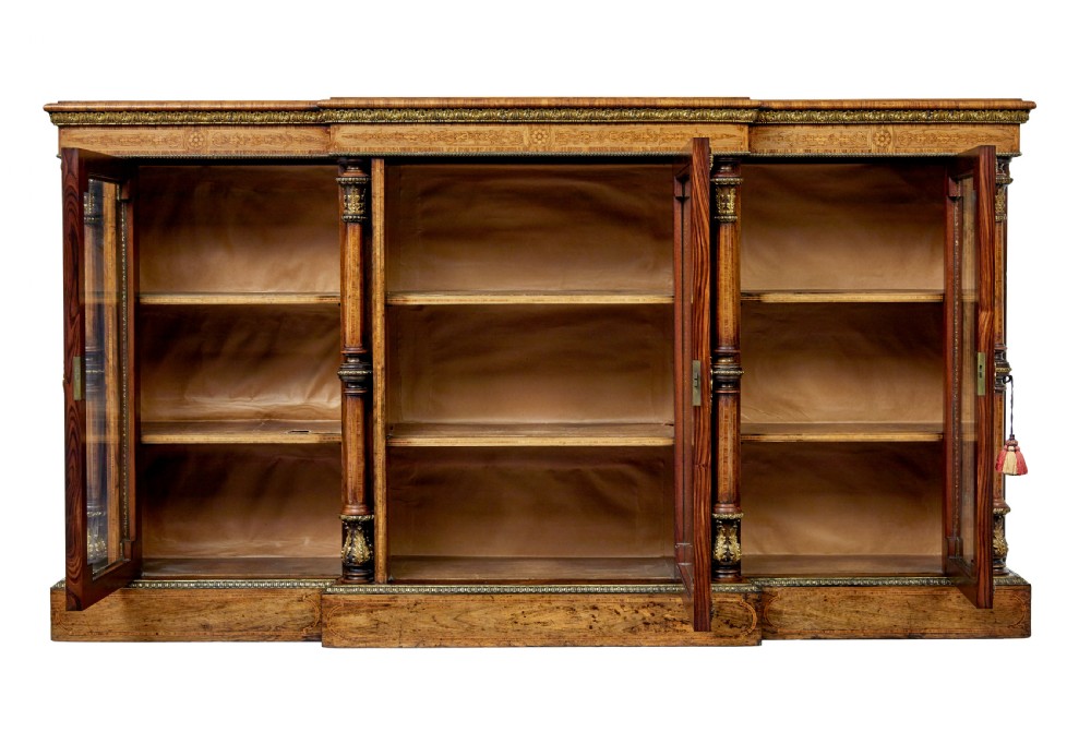 A mid-19th century Victorian walnut credenza featuring three glass-fronted doors, intricate marquetry inlay, and ornate gilt-bronze mounts. View III