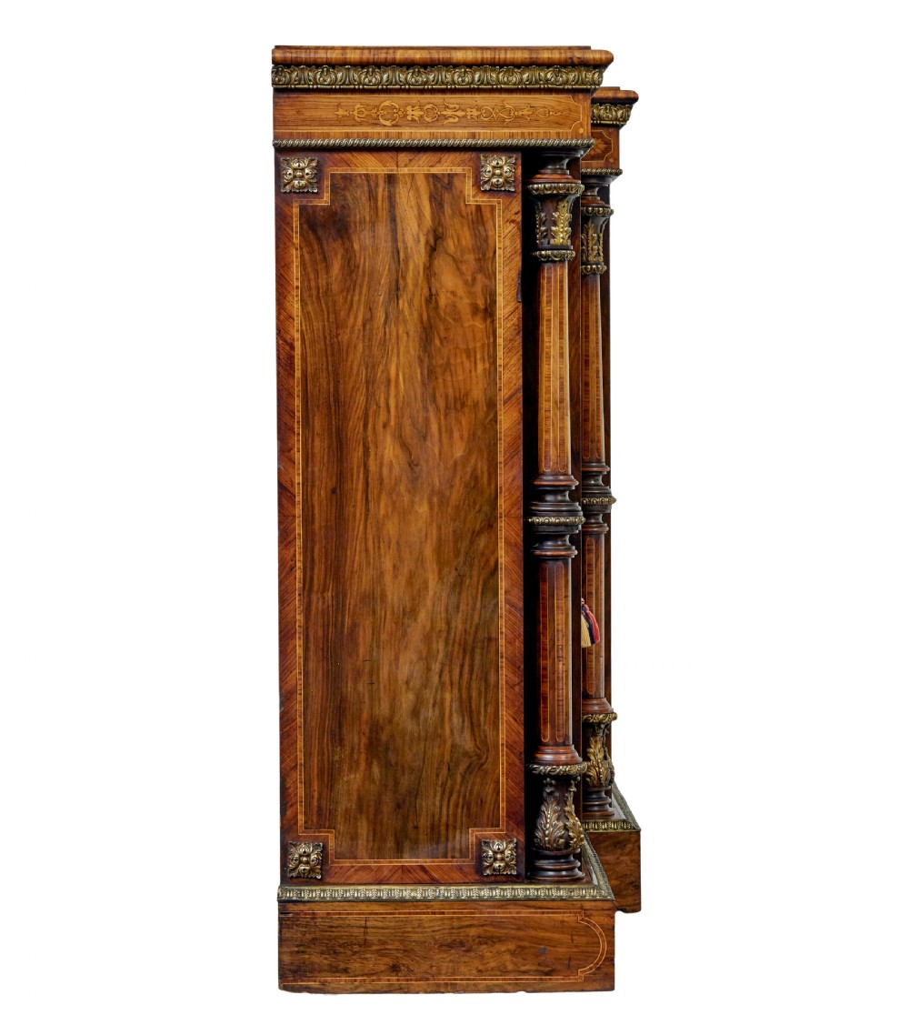 A mid-19th century Victorian walnut credenza featuring three glass-fronted doors, intricate marquetry inlay, and ornate gilt-bronze mounts. View IV