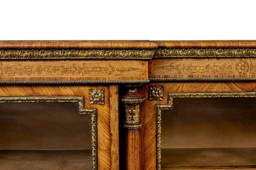 A mid-19th century Victorian walnut credenza featuring three glass-fronted doors, intricate marquetry inlay, and ornate gilt-bronze mounts. View VIII