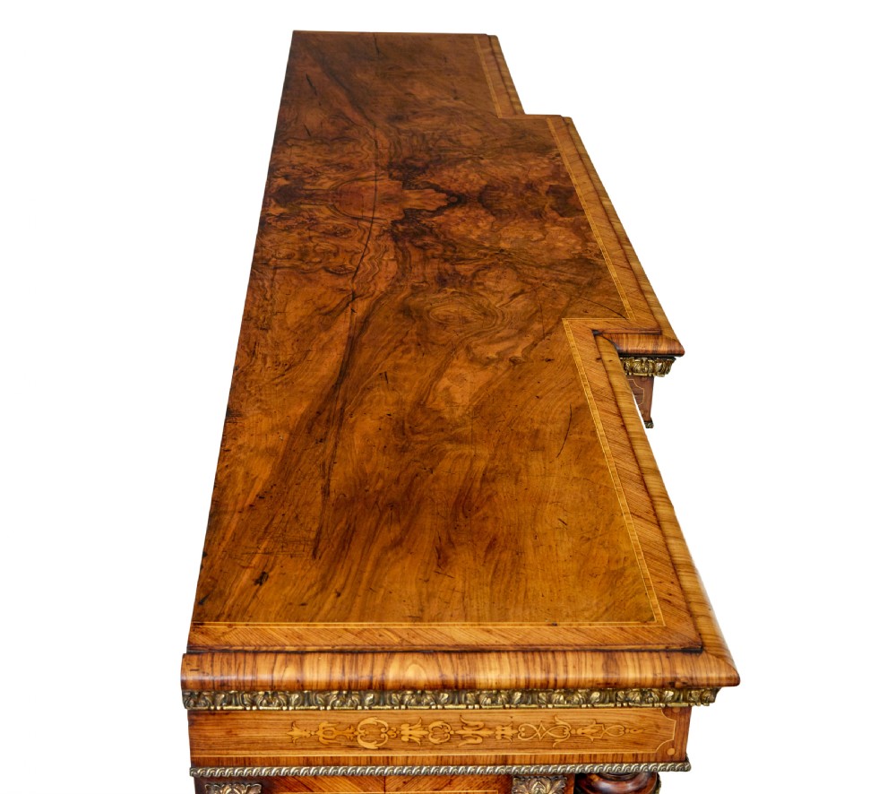 A mid-19th century Victorian walnut credenza featuring three glass-fronted doors, intricate marquetry inlay, and ornate gilt-bronze mounts. View XII