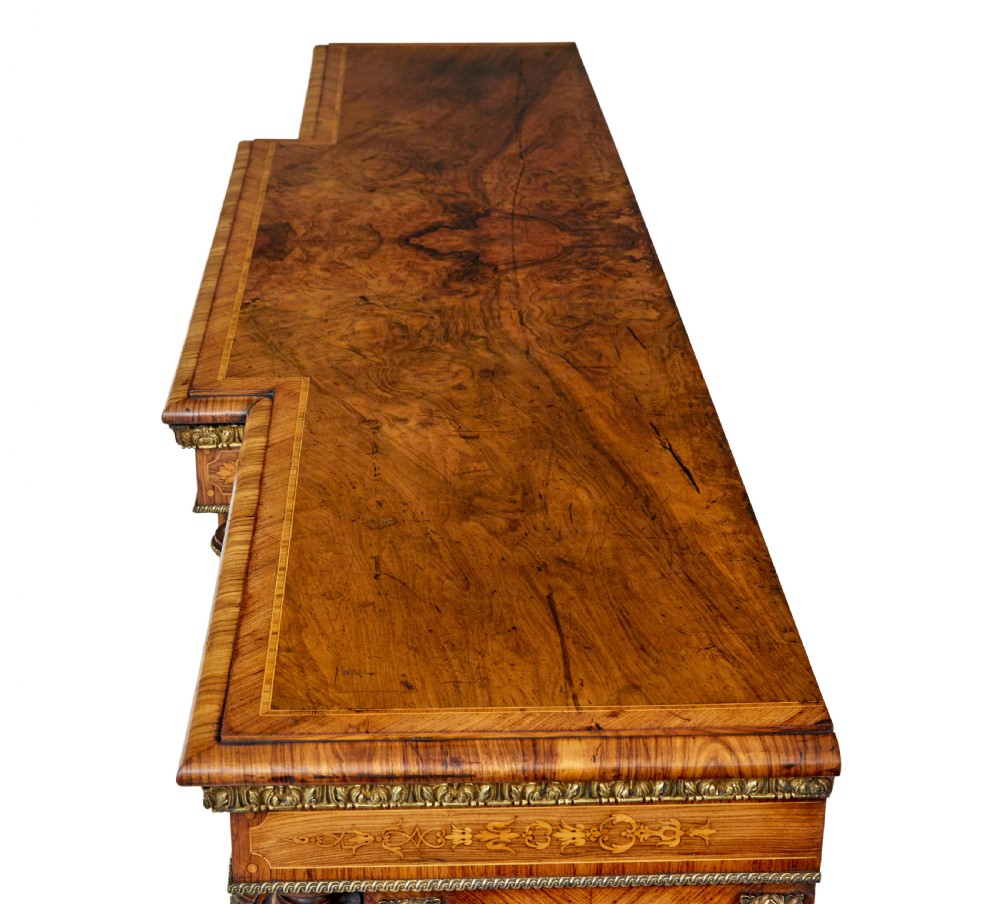 A mid-19th century Victorian walnut credenza featuring three glass-fronted doors, intricate marquetry inlay, and ornate gilt-bronze mounts. View XIII