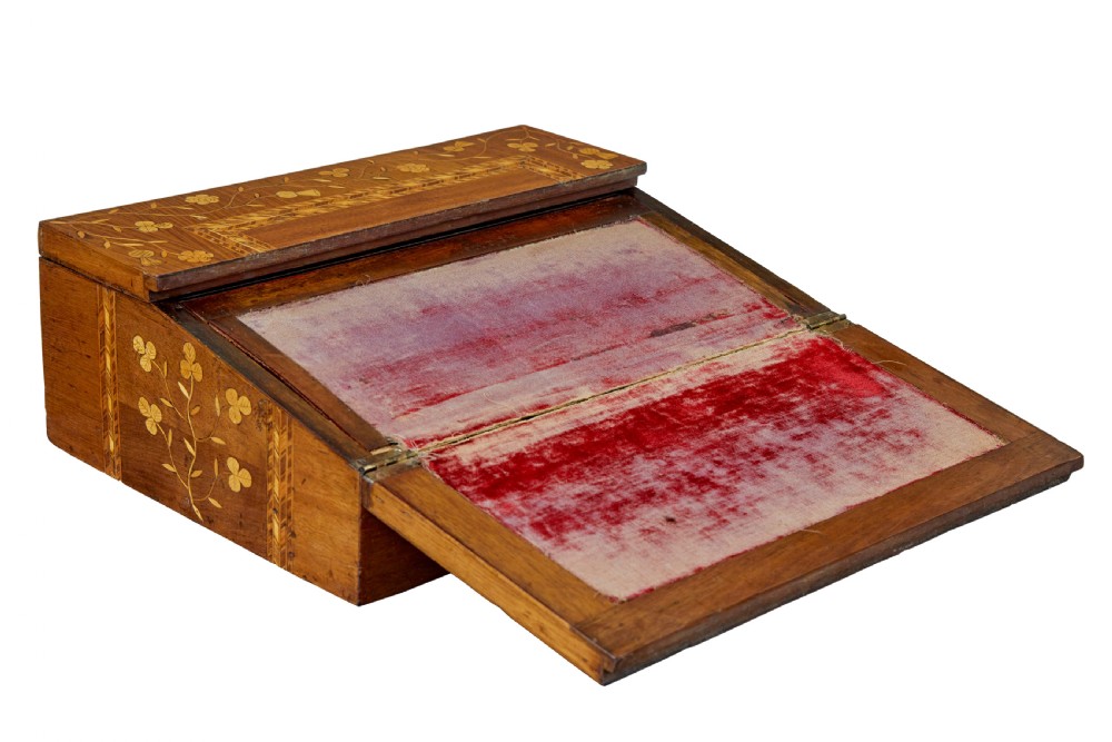 A 19th-century wooden writing slope decorated with marquetry inlays of shamrocks and botanical motifs across the sloped lid. View II