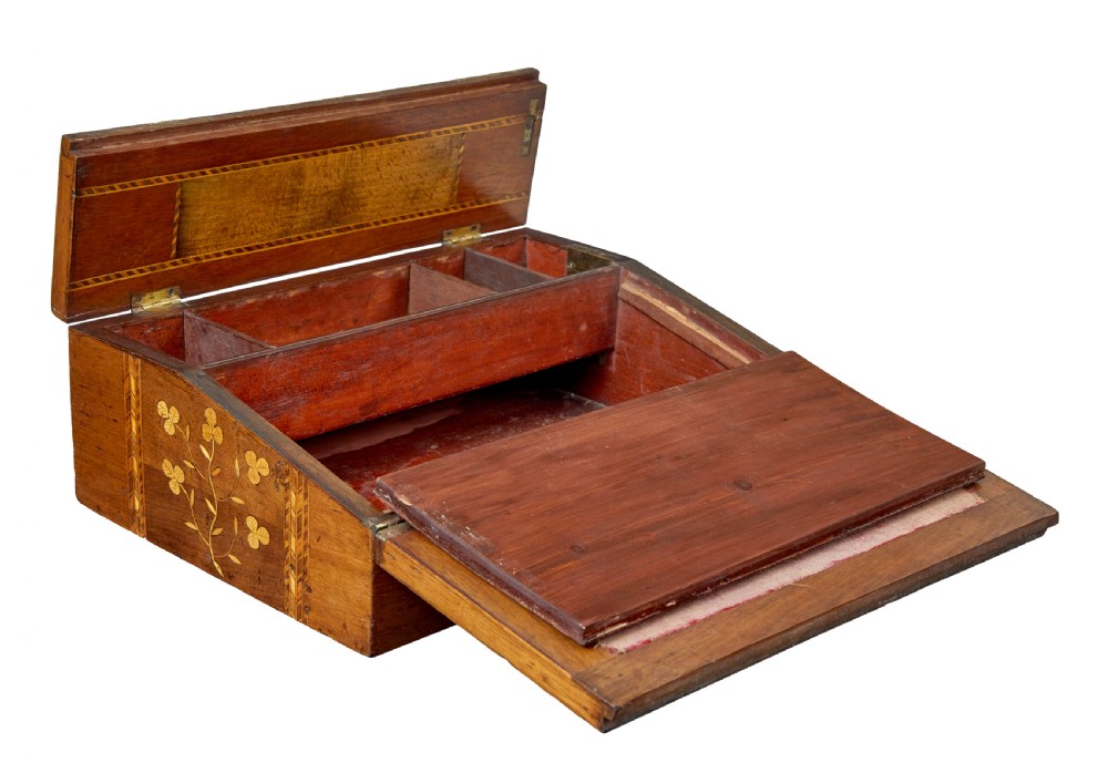 A 19th-century wooden writing slope decorated with marquetry inlays of shamrocks and botanical motifs across the sloped lid. View III