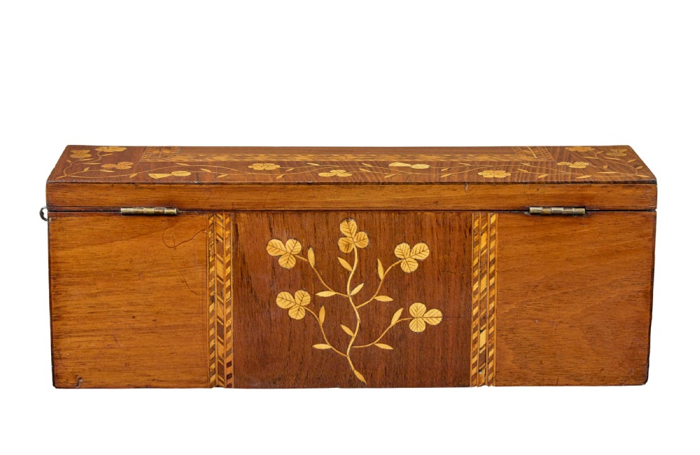 A 19th-century wooden writing slope decorated with marquetry inlays of shamrocks and botanical motifs across the sloped lid. View VII
