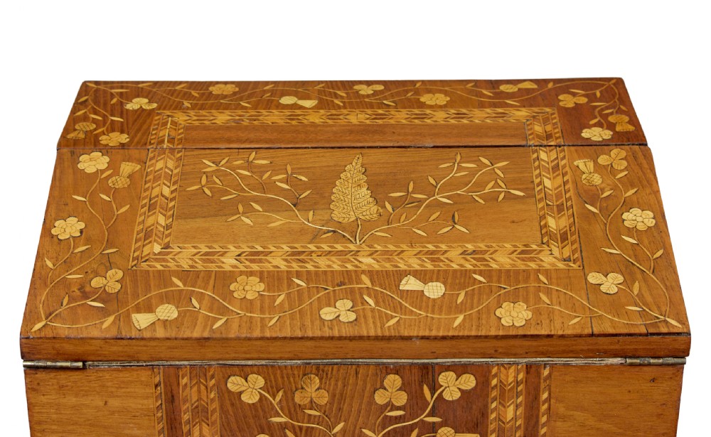 A 19th-century wooden writing slope decorated with marquetry inlays of shamrocks and botanical motifs across the sloped lid. View IX