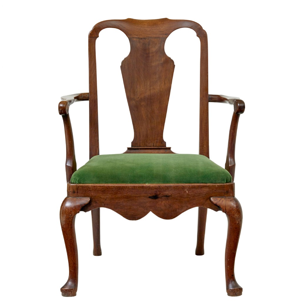 An 18th-century walnut open armchair featuring a contoured vase splat back, curved arms, a green velvet seat, and front cabriole legs with pad feet. View II