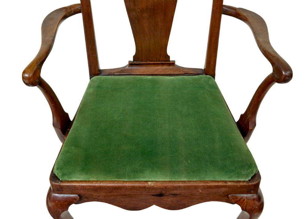 An 18th-century walnut open armchair featuring a contoured vase splat back, curved arms, a green velvet seat, and front cabriole legs with pad feet. View VII