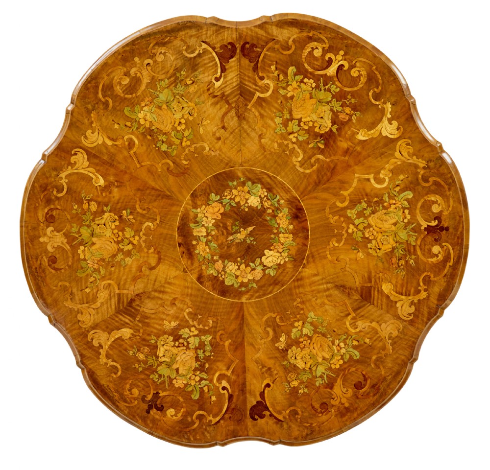 A 19th-century Victorian walnut centre table featuring intricate floral marquetry inlays, a shaped rim, and a carved central pedestal with four scroll legs on castors. View III