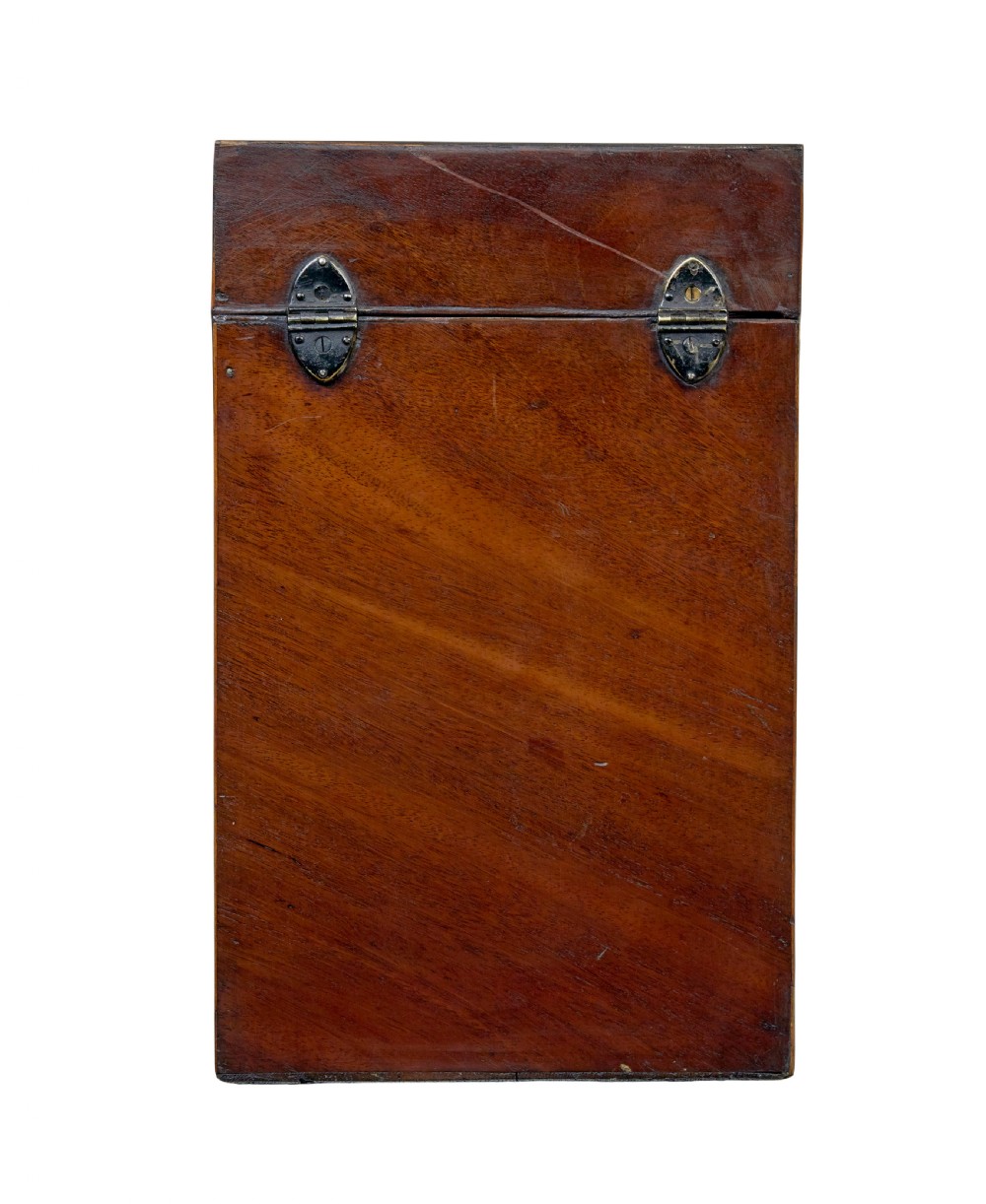 An 18th-century Georgian mahogany knife box featuring a sloping lid with a central floral marquetry inlay, serpentine front profile, and brass keyhole escutcheon. View V