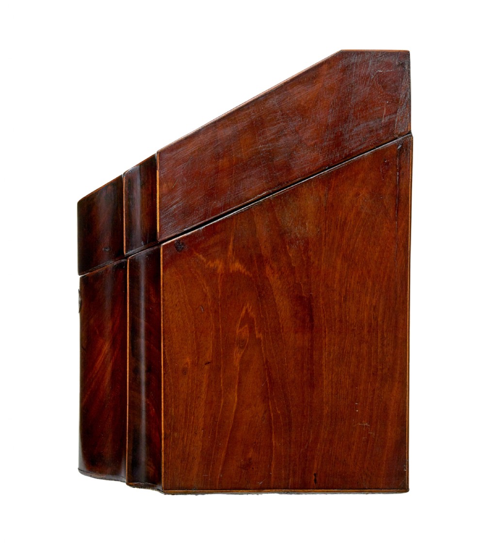 An 18th-century Georgian mahogany knife box featuring a sloping lid with a central floral marquetry inlay, serpentine front profile, and brass keyhole escutcheon. View VII