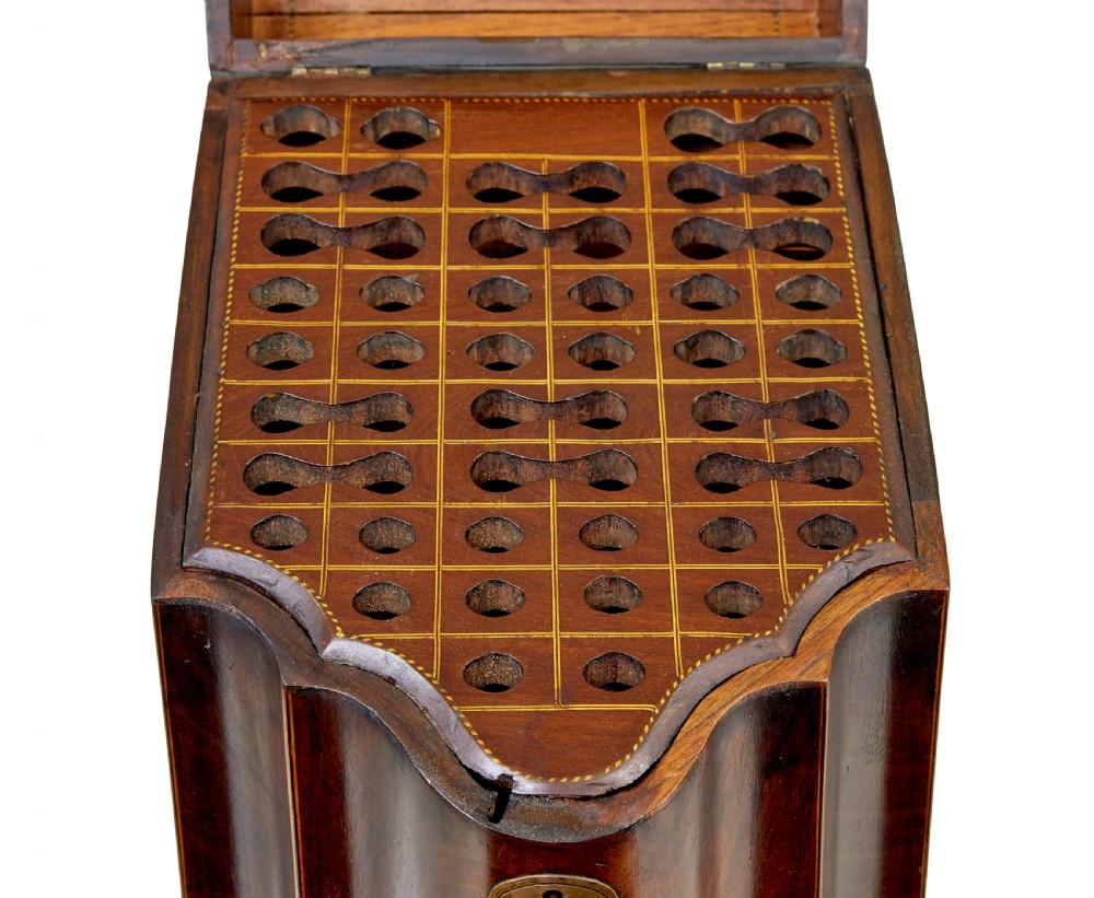 An 18th-century Georgian mahogany knife box featuring a sloping lid with a central floral marquetry inlay, serpentine front profile, and brass keyhole escutcheon. View VIII