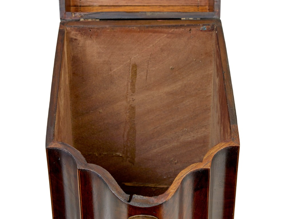 An 18th-century Georgian mahogany knife box featuring a sloping lid with a central floral marquetry inlay, serpentine front profile, and brass keyhole escutcheon. View IX