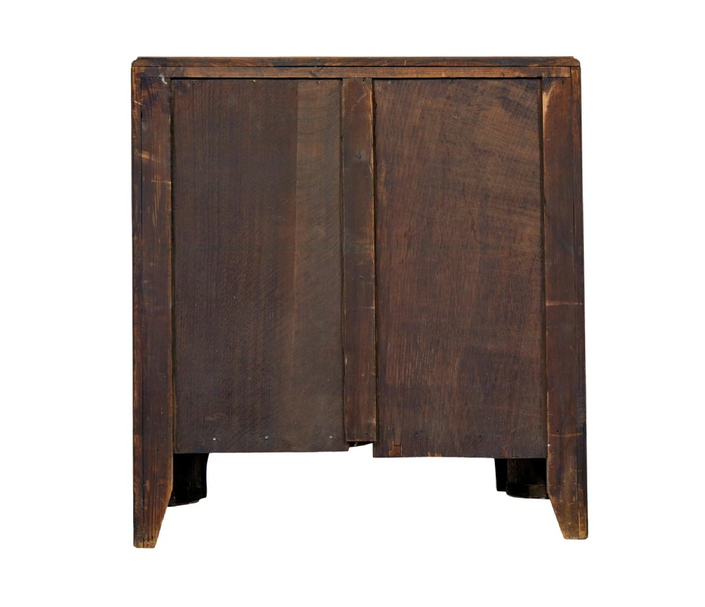 A four-drawer walnut chest featuring figured wood veneers, shaped bottom apron, brass handles, and rounded front corners. View XII