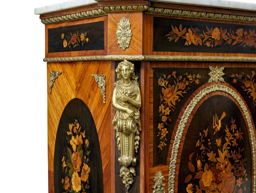 A 19th-century Louis XVI style meuble dappui featuring floral marquetry wood inlays, gilt-bronze mounts, twin doors, and a white marble top. View VII
