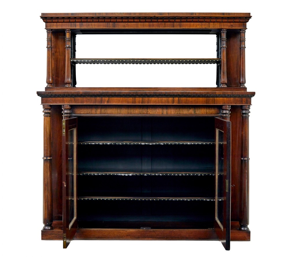A mid 19th-century dark palisander wood chiffonier with turned columns, glazed cabinet doors, and an upper display shelf structure with mirror backing. View II