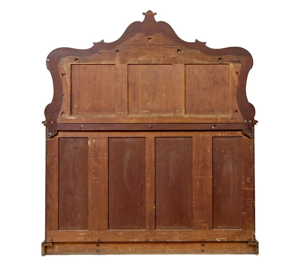 A High Victorian burr walnut credenza featuring floral marquetry inlay, glazed side display cabinets, gilt metal mounts, and a shaped mirror frame superstructure. View VIII