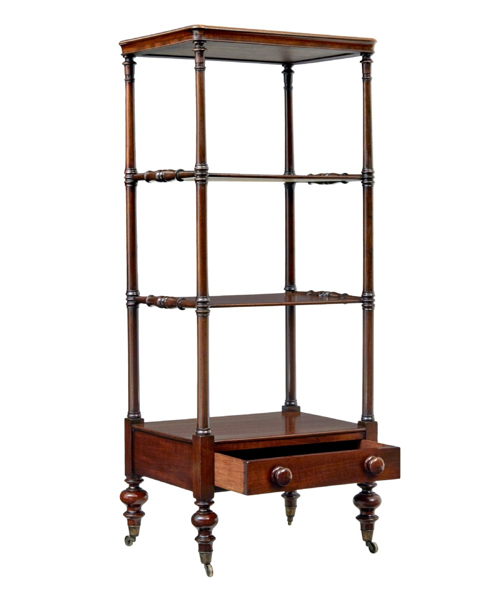 A mid-19th-century mahogany four-tier whatnot featuring slender turned supports, a single base drawer with turned wooden handles, and turned legs with brass castors. View II