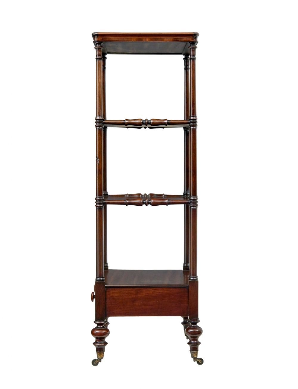 A mid-19th-century mahogany four-tier whatnot featuring slender turned supports, a single base drawer with turned wooden handles, and turned legs with brass castors. View IV
