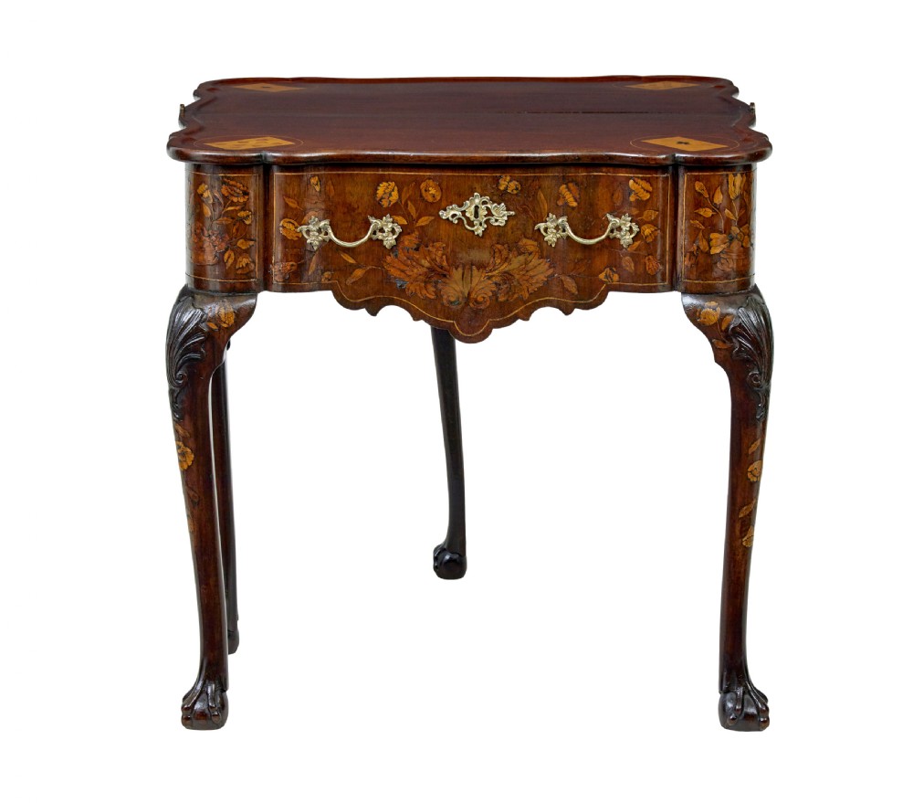 An 18th-century Dutch walnut games table decorated with floral marquetry inlay, carved cabriole legs, and brass drop handles. View II