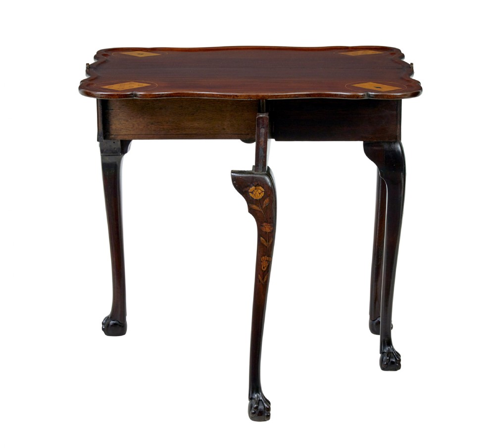 An 18th-century Dutch walnut games table decorated with floral marquetry inlay, carved cabriole legs, and brass drop handles. View IV