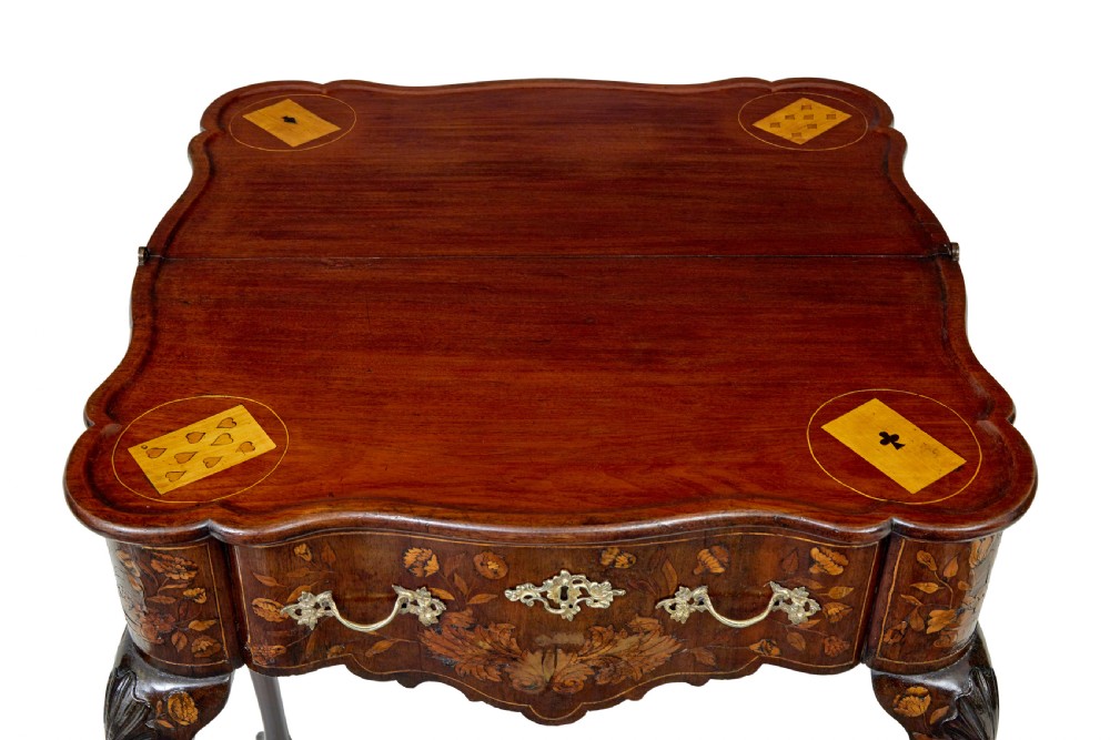 An 18th-century Dutch walnut games table decorated with floral marquetry inlay, carved cabriole legs, and brass drop handles. View VIII