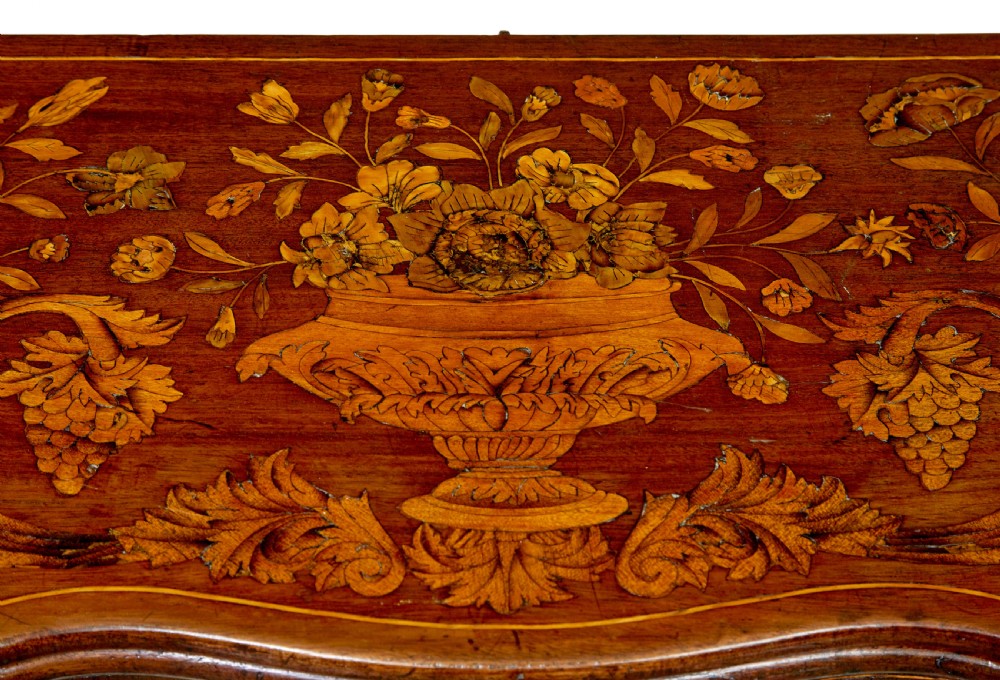 An 18th-century Dutch walnut games table decorated with floral marquetry inlay, carved cabriole legs, and brass drop handles. View XI