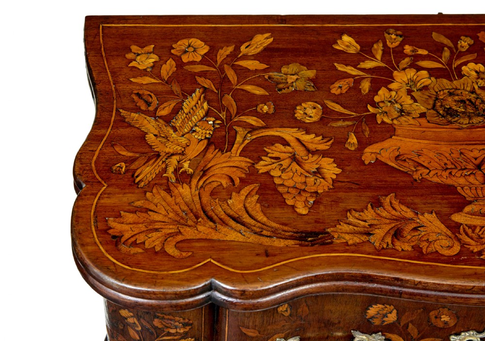 An 18th-century Dutch walnut games table decorated with floral marquetry inlay, carved cabriole legs, and brass drop handles. View XII