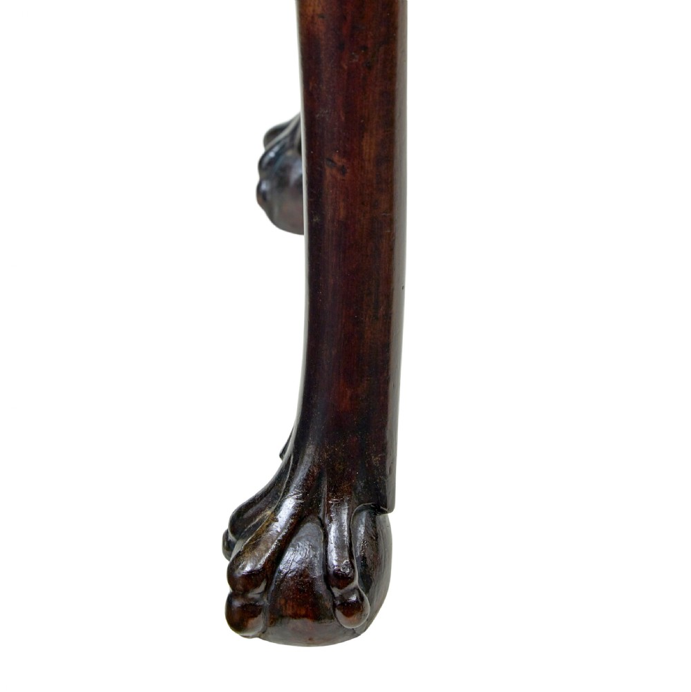 An 18th-century Dutch walnut games table decorated with floral marquetry inlay, carved cabriole legs, and brass drop handles. View XV