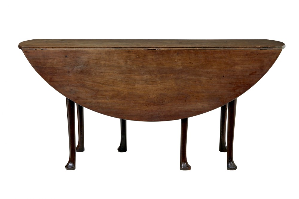An 18th-century Chippendale mahogany drop-leaf gateleg dining table with cabriole legs and pad feet. View II