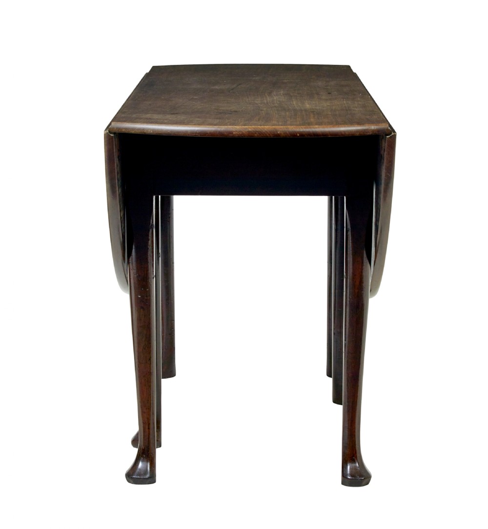 An 18th-century Chippendale mahogany drop-leaf gateleg dining table with cabriole legs and pad feet. View III
