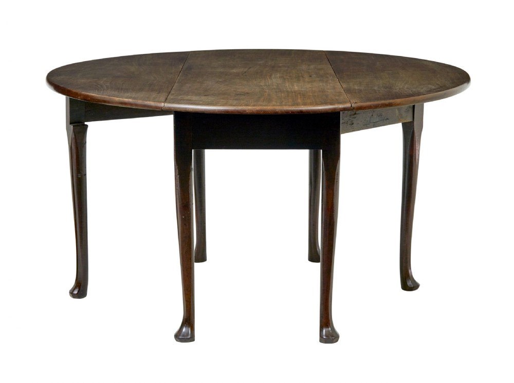 An 18th-century Chippendale mahogany drop-leaf gateleg dining table with cabriole legs and pad feet. View VI