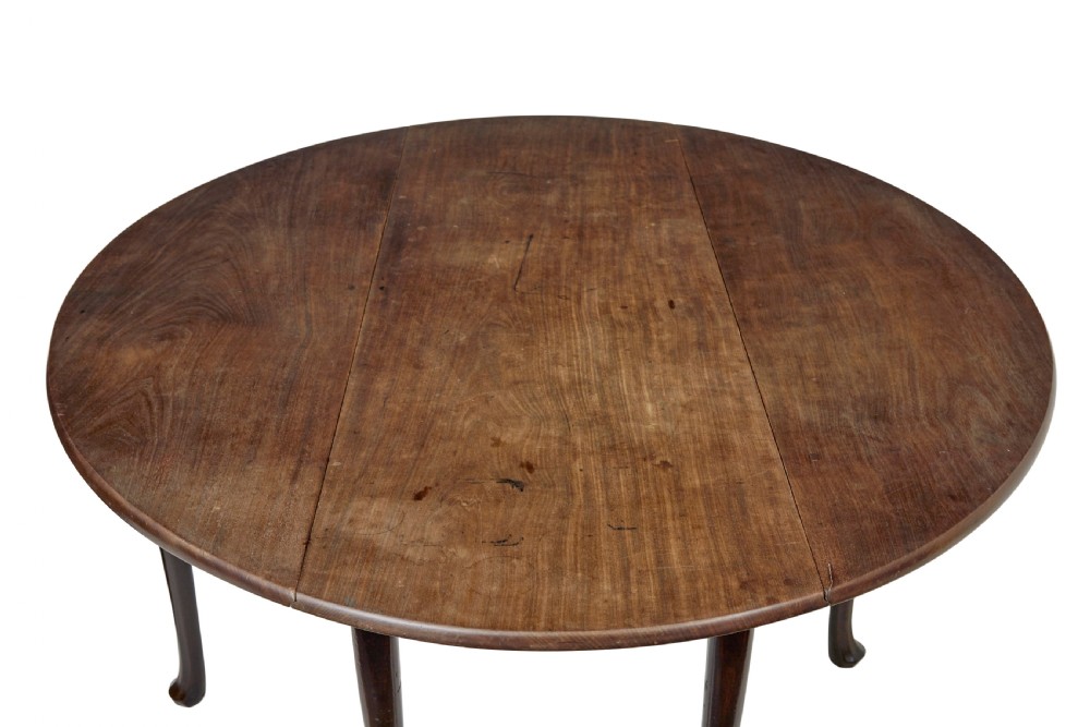 An 18th-century Chippendale mahogany drop-leaf gateleg dining table with cabriole legs and pad feet. View VII
