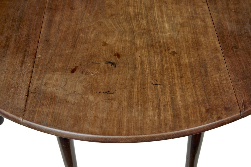 An 18th-century Chippendale mahogany drop-leaf gateleg dining table with cabriole legs and pad feet. View VIII