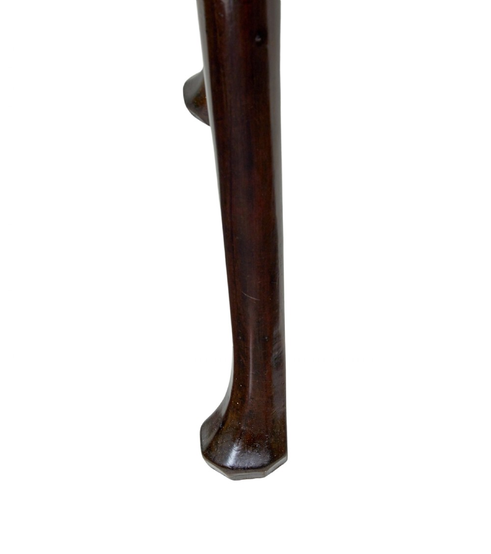 An 18th-century Chippendale mahogany drop-leaf gateleg dining table with cabriole legs and pad feet. View X