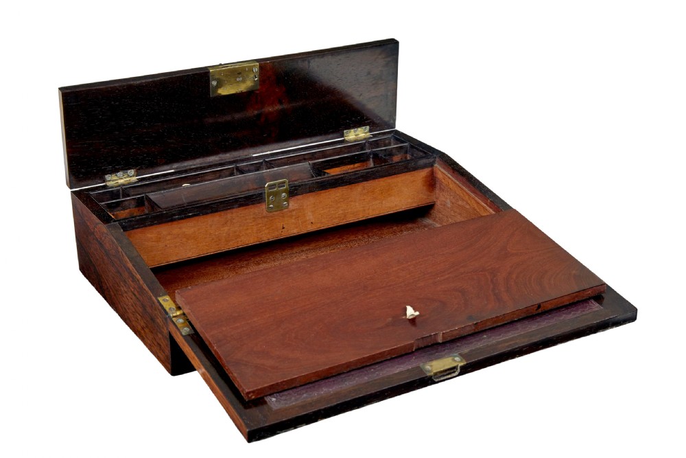 A 19th-century William IV figured rosewood writing slope featuring a slanted top, metal key, and an inlaid plaque dated 1835. View III