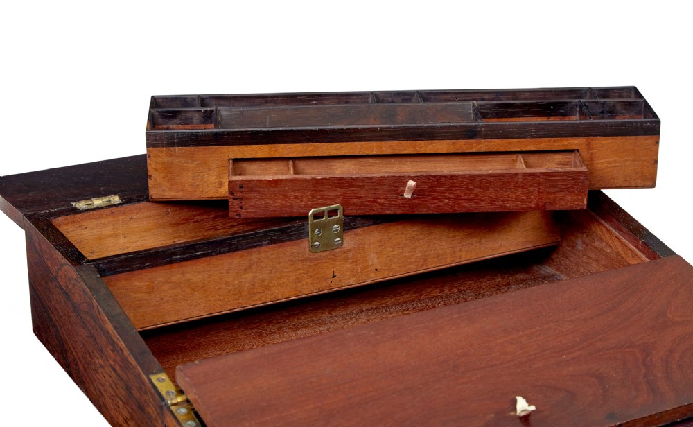 A 19th-century William IV figured rosewood writing slope featuring a slanted top, metal key, and an inlaid plaque dated 1835. View IV