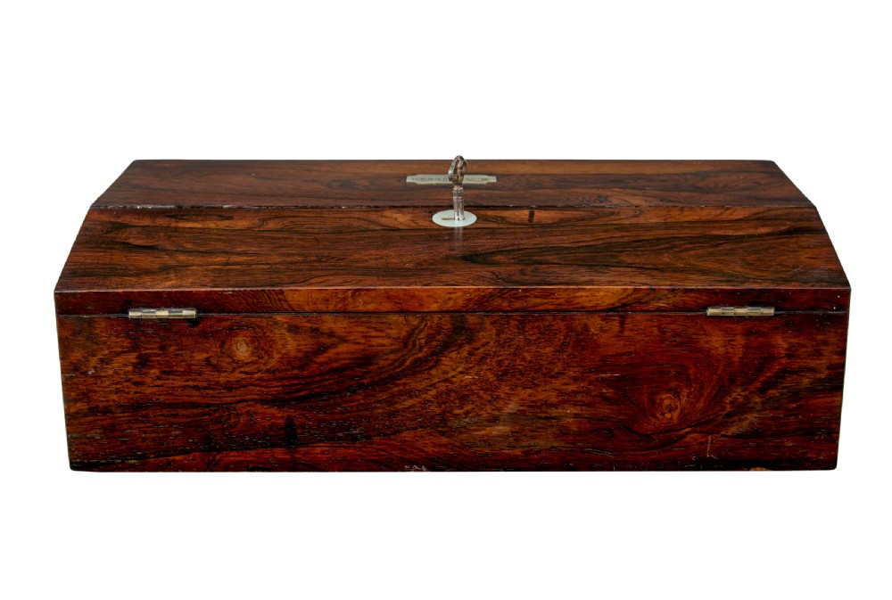 A 19th-century William IV figured rosewood writing slope featuring a slanted top, metal key, and an inlaid plaque dated 1835. View VII