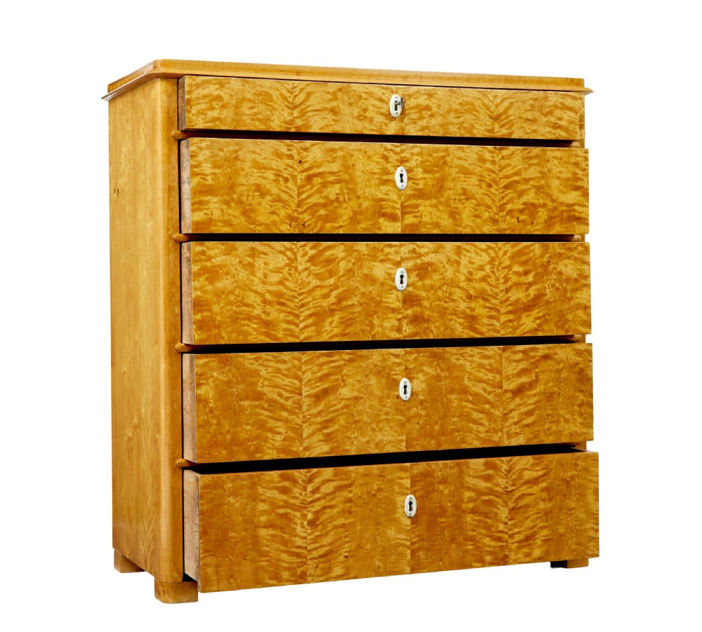 A 19th-century Swedish flame birch chest featuring five graduated drawers with white keyhole escutcheons. View II