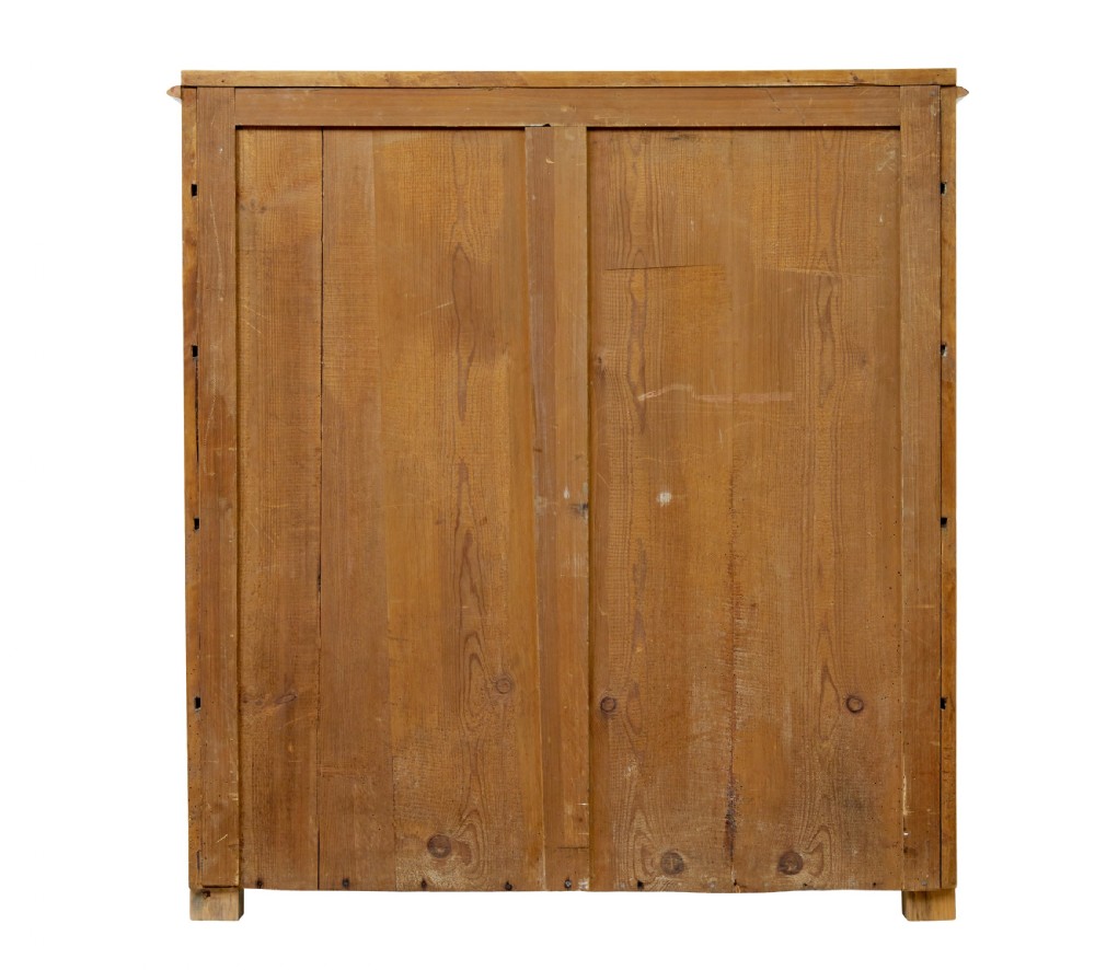 A 19th-century Swedish flame birch chest featuring five graduated drawers with white keyhole escutcheons. View VI