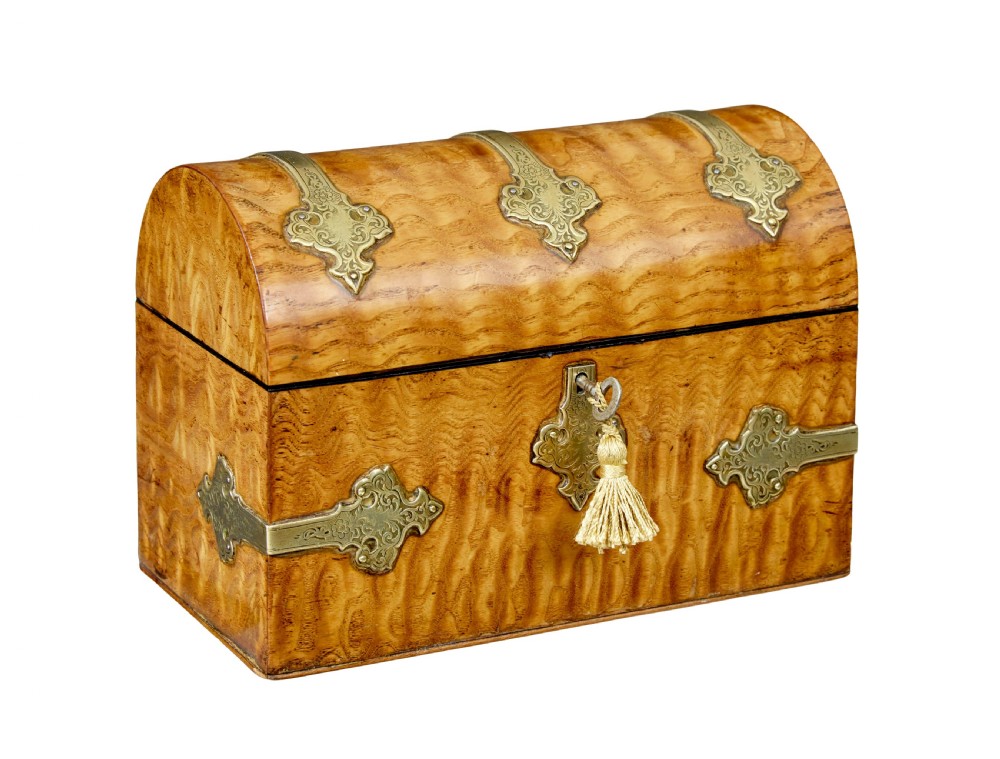 A nineteenth-century dome-topped pollard oak stationery box featuring ornate engraved brass strapwork mounts and a key in the lock escutcheon.