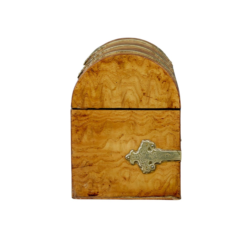 A nineteenth-century dome-topped pollard oak stationery box featuring ornate engraved brass strapwork mounts and a key in the lock escutcheon. View VII
