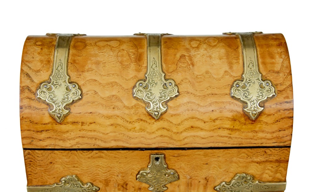A nineteenth-century dome-topped pollard oak stationery box featuring ornate engraved brass strapwork mounts and a key in the lock escutcheon. View X