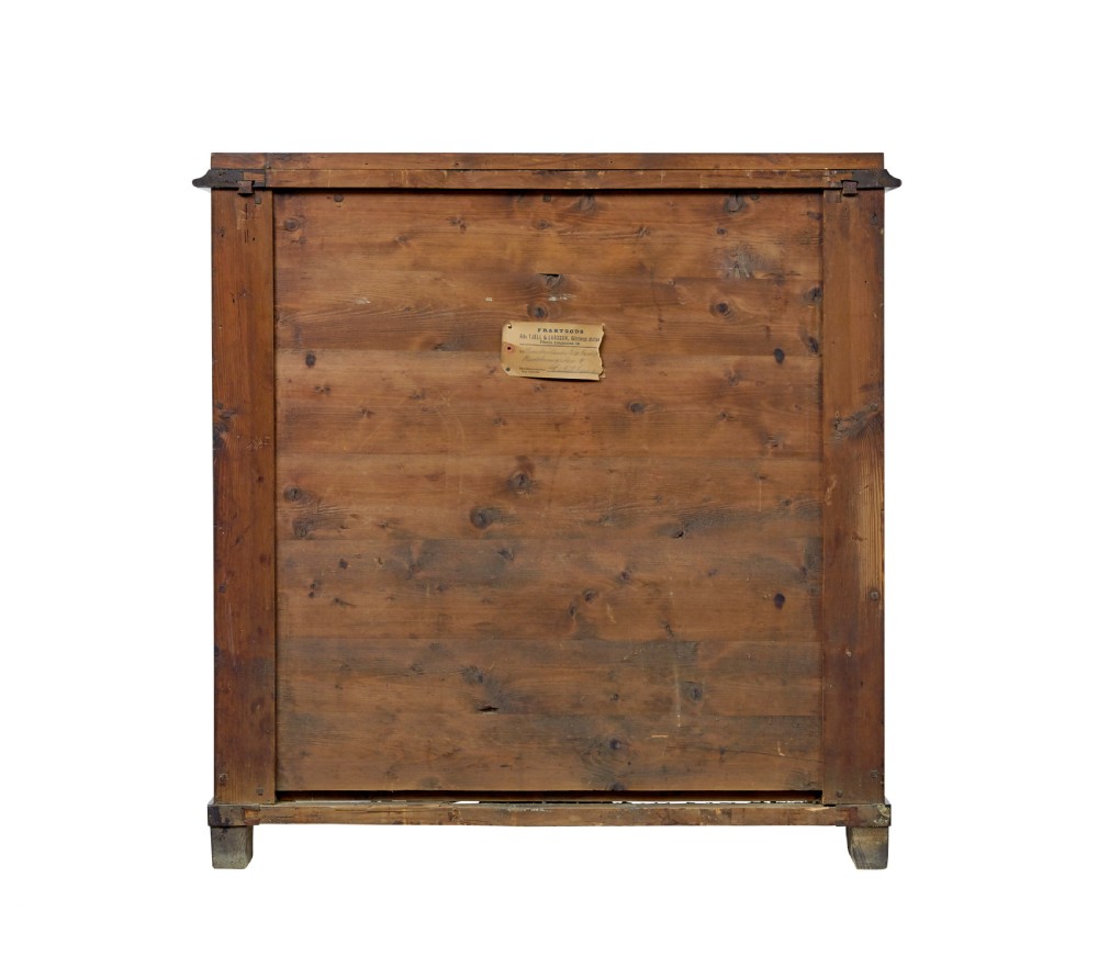 A 19th-century Swedish mahogany chest of drawers with a serpentine front, four drawers, flame timber veneer, carved side accents, and turned feet. View VI
