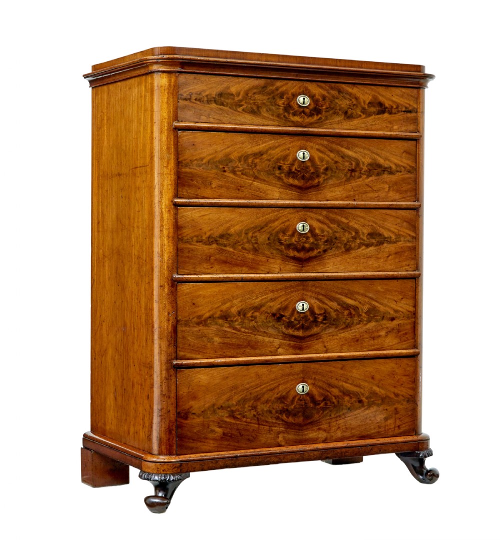 A nineteenth-century Swedish mahogany chest of drawers featuring five stacked drawers with book-matched veneer and brass keyhole escutcheons.