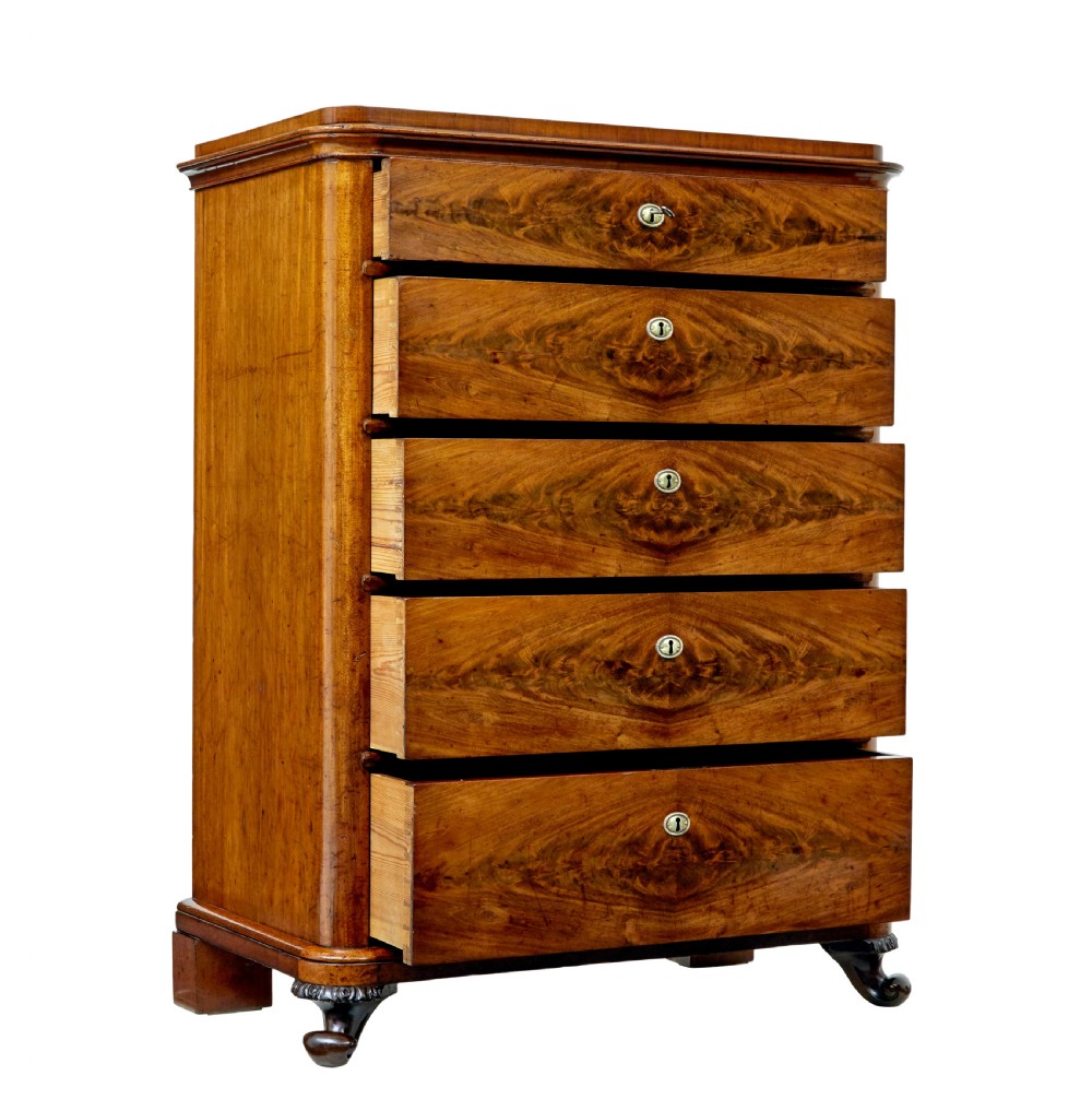 A nineteenth-century Swedish mahogany chest of drawers featuring five stacked drawers with book-matched veneer and brass keyhole escutcheons. View II